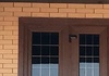 Металлопластиковые коричневые двери.